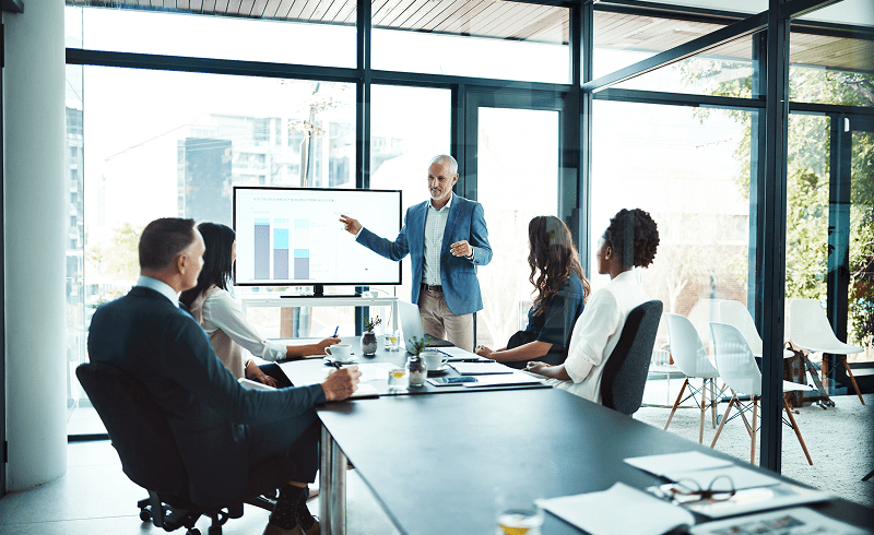 Business meeting with presentation in modern office.