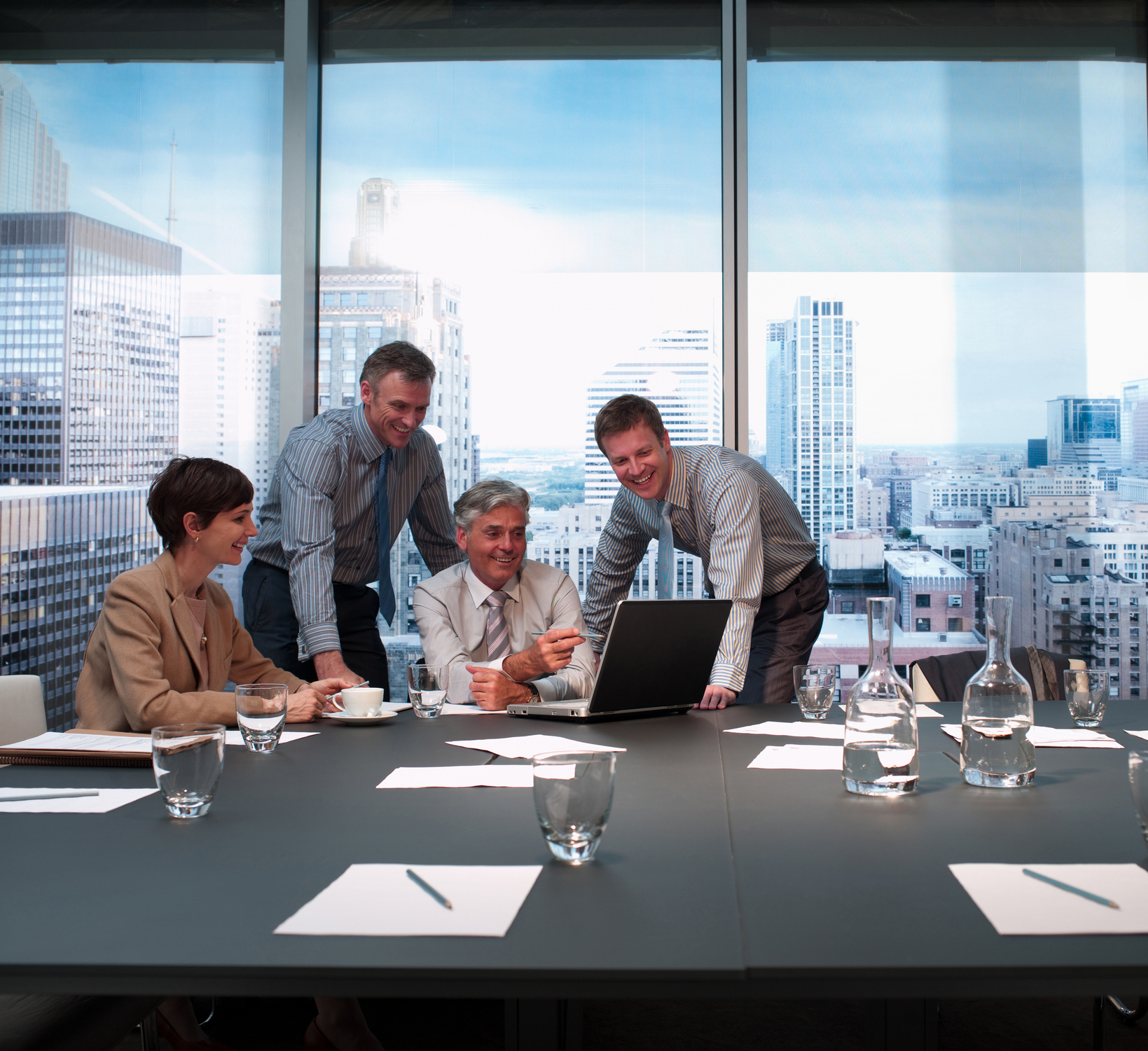 Corporate meeting with a city view.